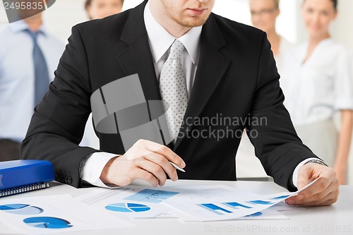 Image of businessman working with papers
