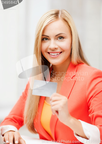 Image of businesswoman with laptop using credit card