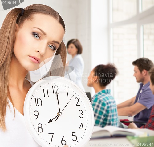 Image of student showing clock