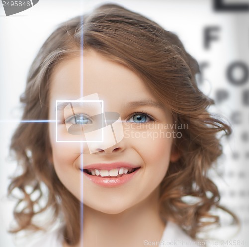 Image of cute girl with eye chart