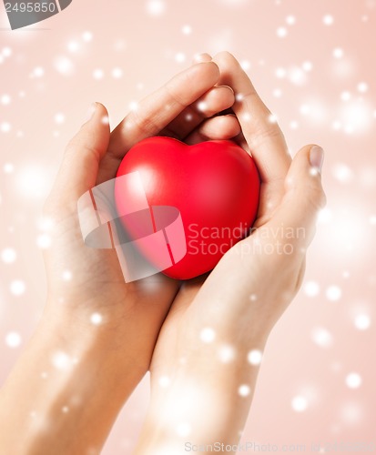 Image of woman hands with heart