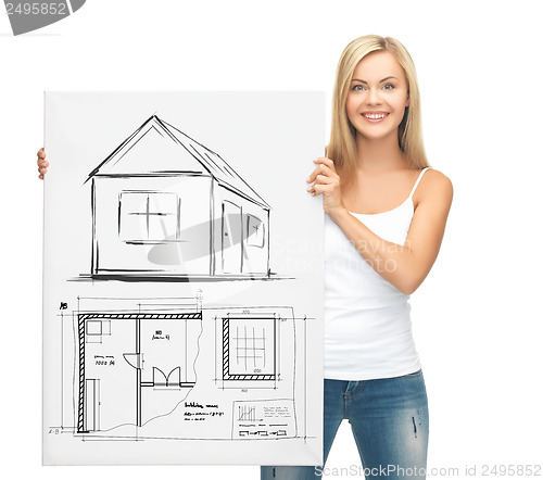 Image of woman holding picture with house