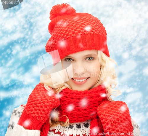 Image of teenage girl in hat, muffler and mittens