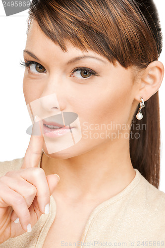 Image of woman with finger on her lips