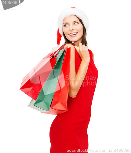 Image of woman in red dress with shopping bags