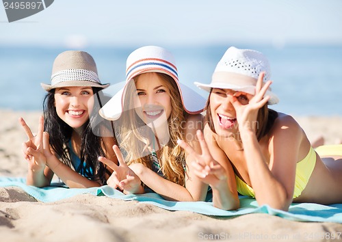 Image of girls sunbathing on the beach