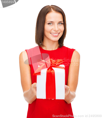 Image of smiling woman in red dress with gift box