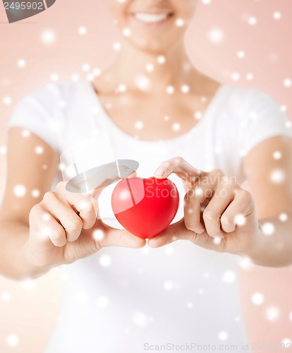 Image of woman hands with heart