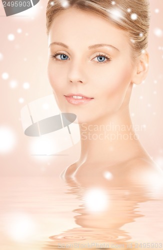 Image of face and shoulders of beautiful woman
