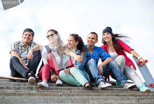 Image of teenagers with skates outside