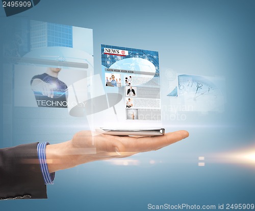 Image of hand and smartphone with news