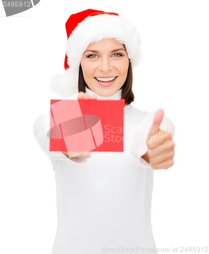 Image of woman in santa helper hat with blank red card
