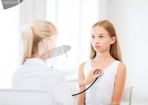 Image of doctor with stethoscope listening to the patient