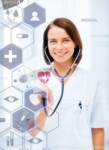 Image of female doctor with stethoscope and virtual screen