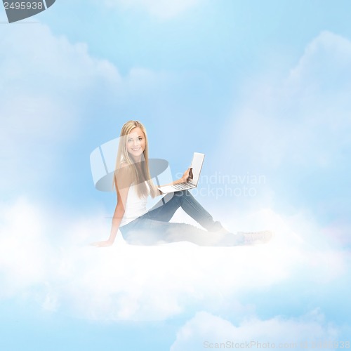 Image of woman sitting on the cloud with laptop