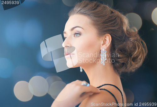 Image of woman with diamond earrings