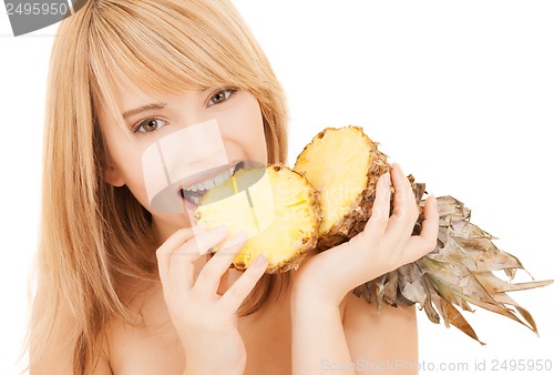 Image of happy girl with pineapple