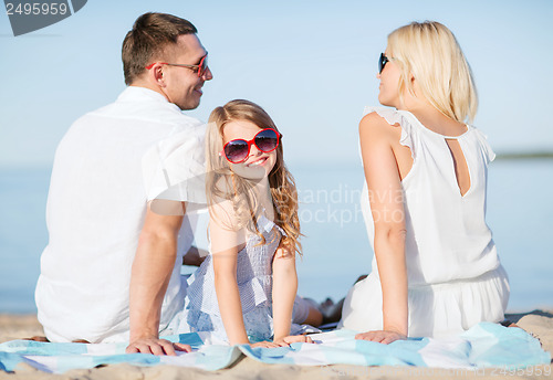 Image of happy family on the beach