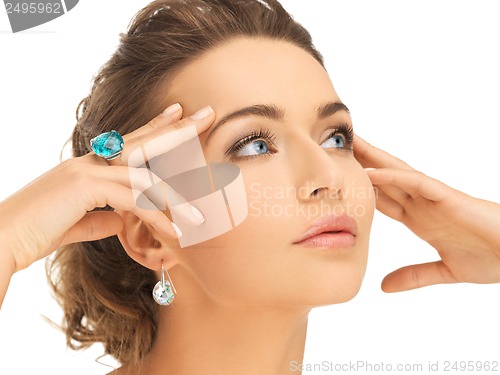 Image of woman with blue cocktail ring