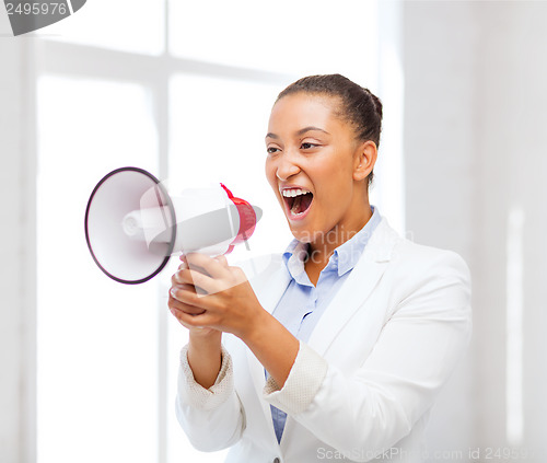 Image of strict businesswoman shouting in megaphone