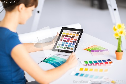 Image of woman working with color samples for selection