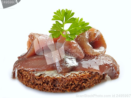 Image of brown bread sandwich with anchovies