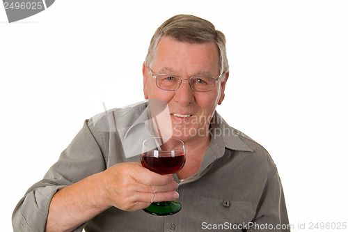 Image of Old man drinking red wine
