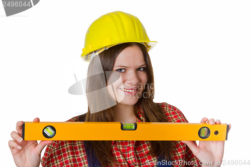 Image of Craftswoman with hardhat and water level