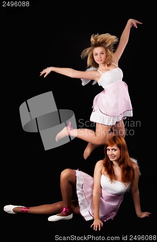 Image of Two pretty girls dancing