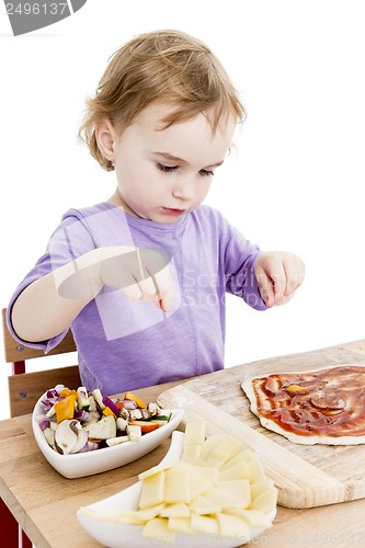Image of homemade pizza by a cute little girl