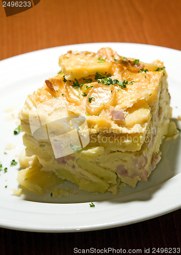 Image of Czech Republic food specialty baked sliced potato  smoked bacon 