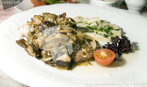 Image of pork sirloin stewed with local seasonal mushrooms  onions Polish