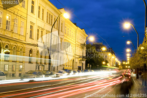 Image of editorial night scene boulevard car tram light streaks historic 