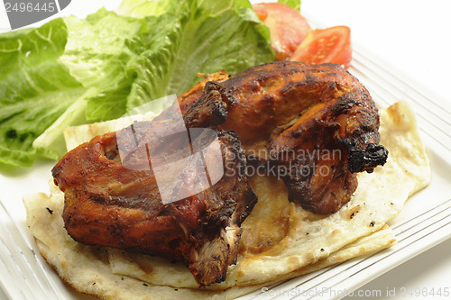 Image of Tandoori chicken side view