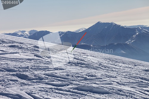 Image of Ski slope with trace from ski and snowboards at sun day