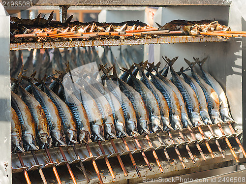 Image of Cooking grilled mackerel on skewers