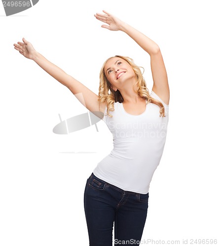 Image of happy dancing woman in blank white t-shirt