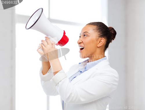 Image of strict businesswoman shouting in megaphone