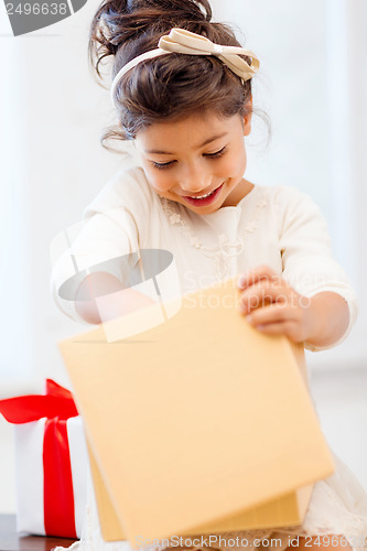 Image of happy child girl with gift box