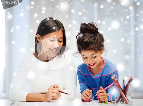 Image of mother and daughter drawing