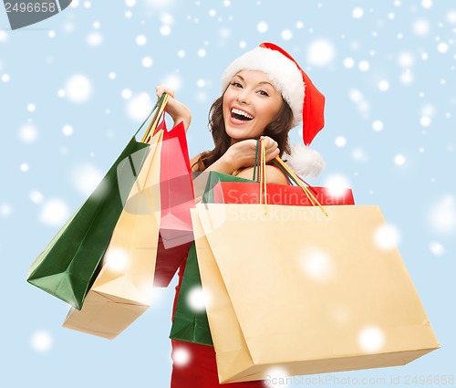 Image of woman in red dress with shopping bags