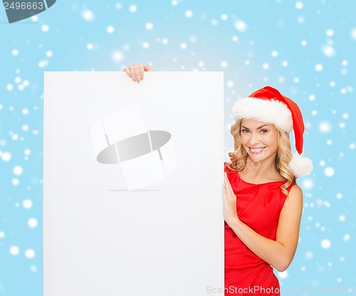 Image of woman in santa helper hat with blank white board