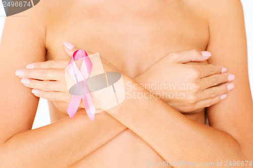 Image of naked woman with breast cancer awareness ribbon