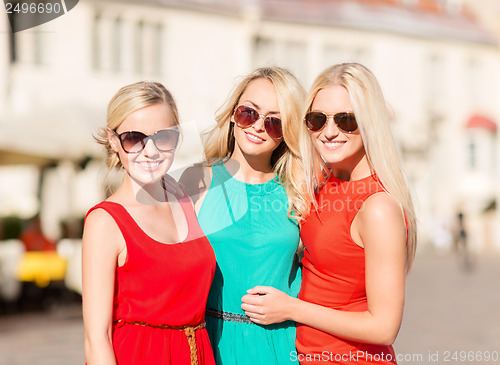 Image of three beautiful women in the city