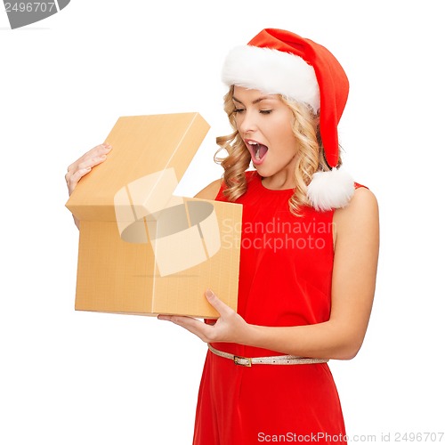 Image of smiling woman in santa helper hat with gift box