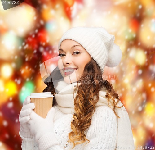 Image of woman in hat with takeaway tea or coffee cup