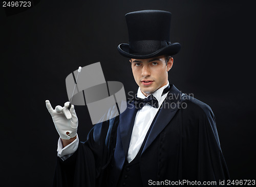 Image of magician in top hat with magic wand showing trick