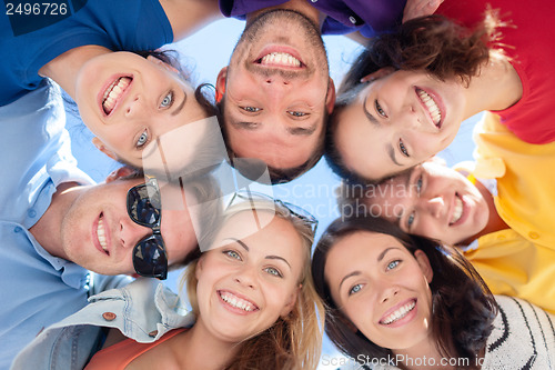 Image of group of teenagers looking down