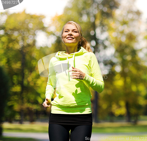 Image of woman jogging outdoors