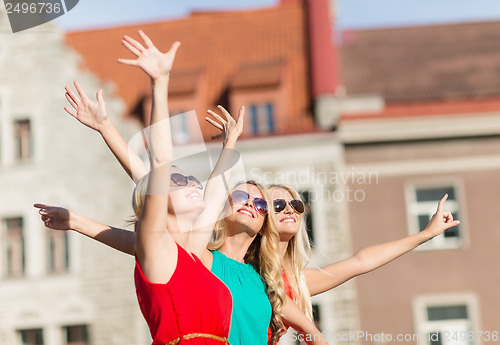 Image of three beautiful women in the city